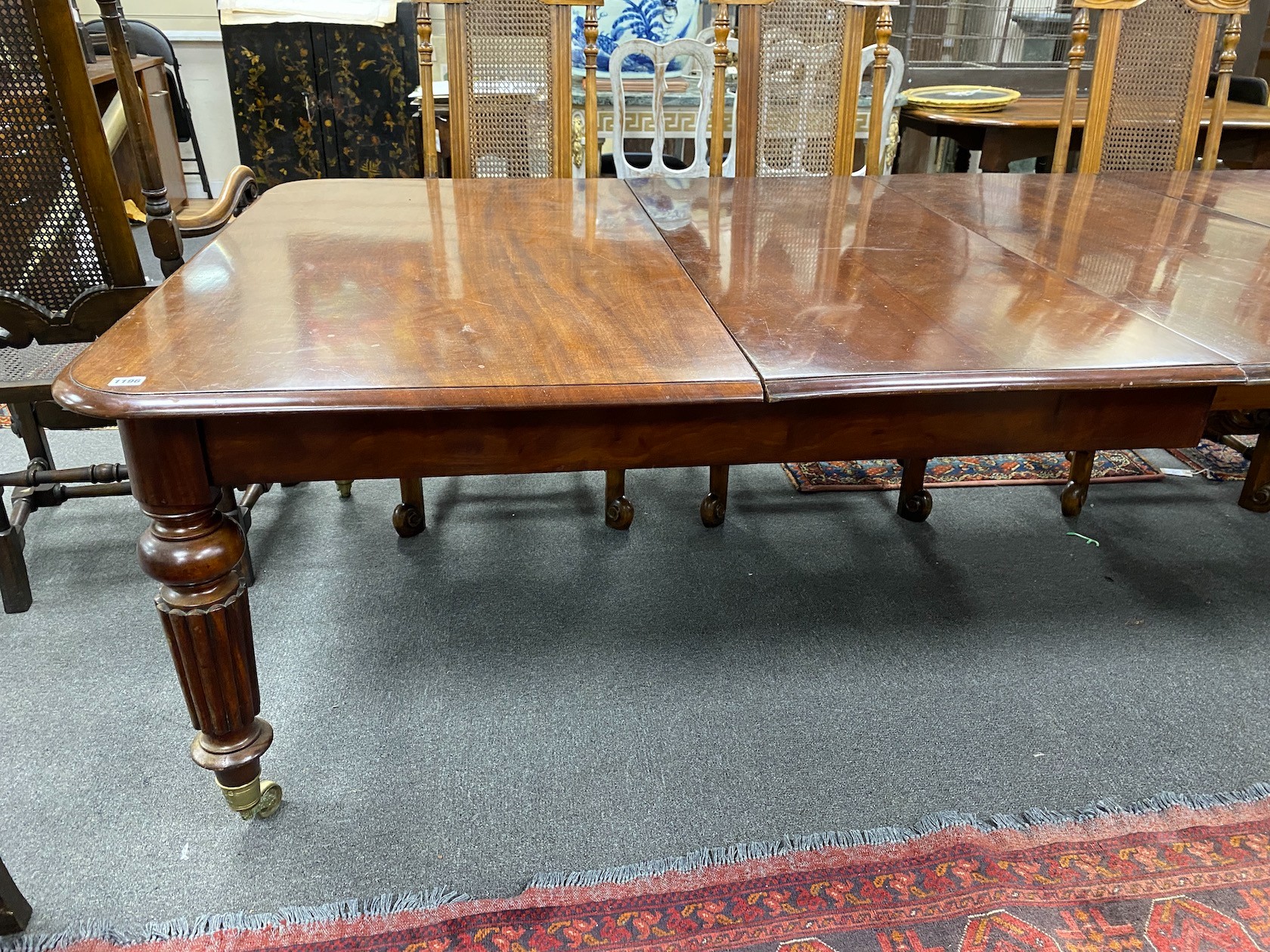 A Victorian mahogany extending dining table, 320cms extended, three spare leaves, depth 130cms, height 73cms.